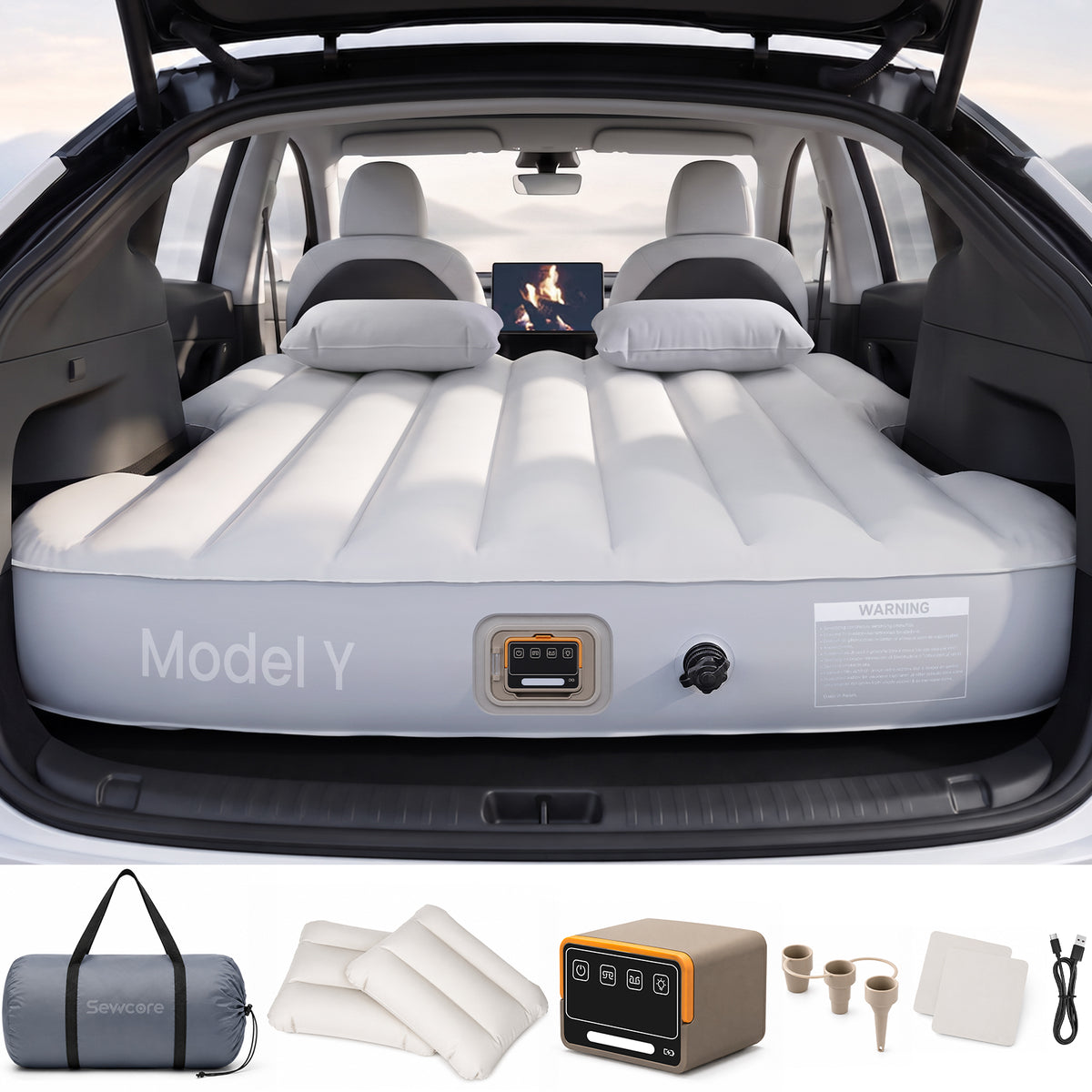 Tesla Model Y air mattress installed with pump and travel accessories