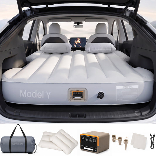 Tesla Model Y air mattress installed with pump and travel accessories